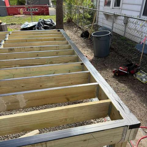 Deck joists beside house