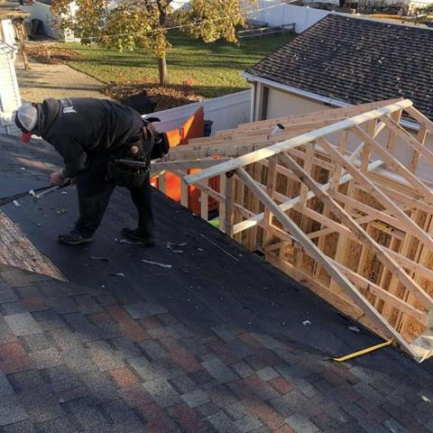 Roof trusses being assembled