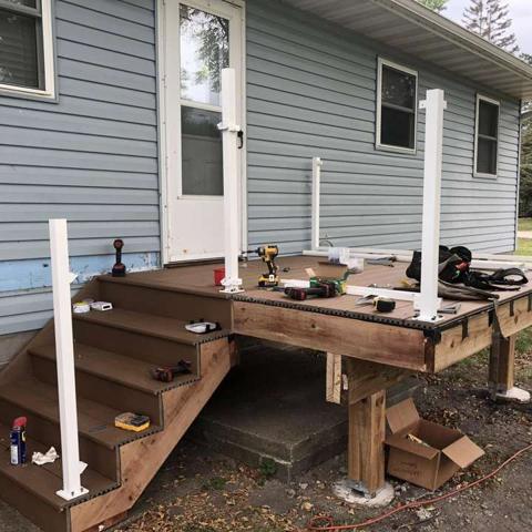 Deck construction beside siding